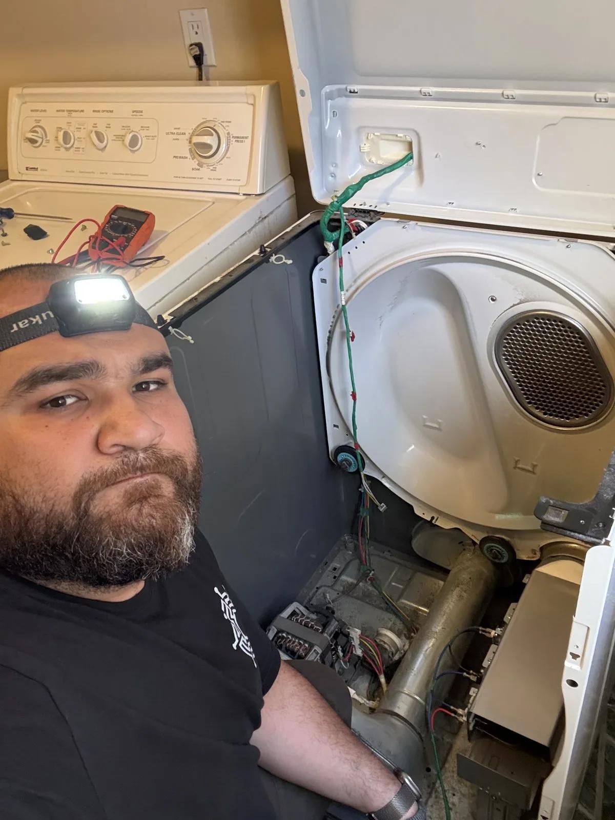Valve technician performing dryer repair